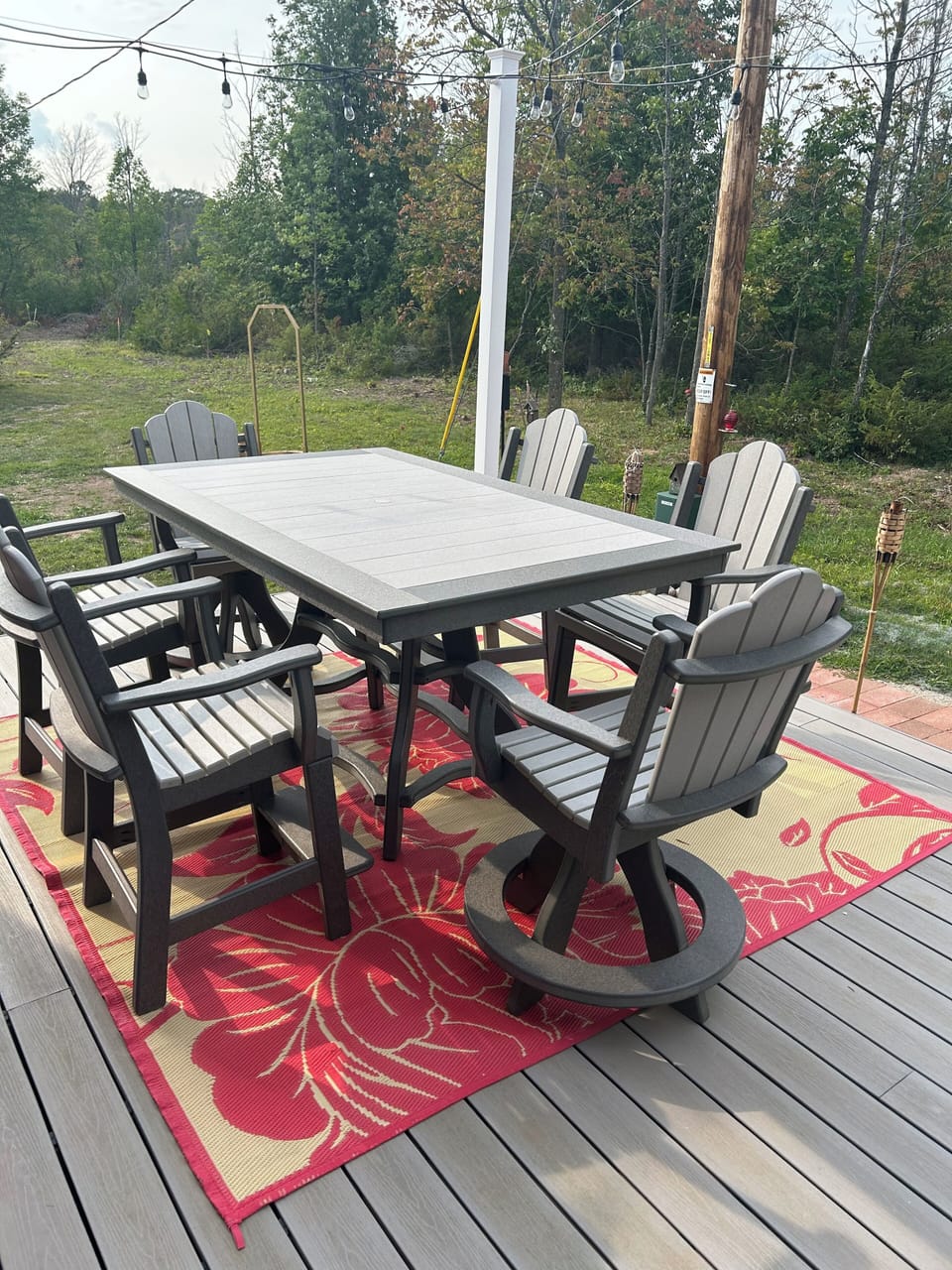 Back deck that is accessed by walking around the back of the building.