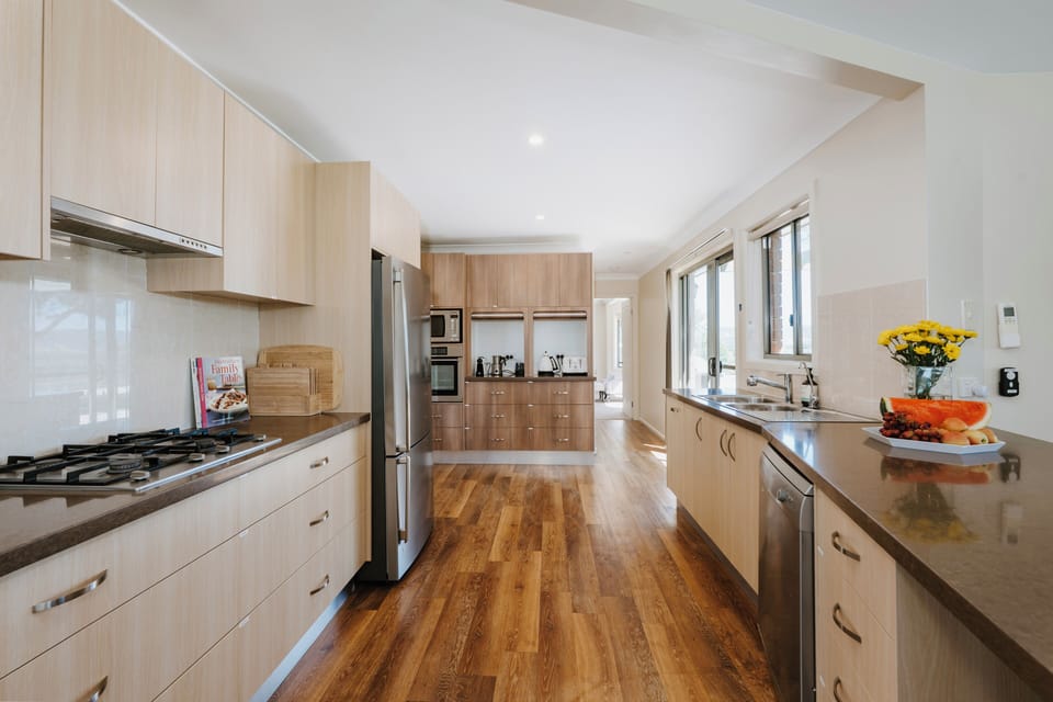 Challenge your inner cook in the well-equipped kitchen, complete with gas cooking, a dishwasher, and everything needed for casual meals or family feasts.