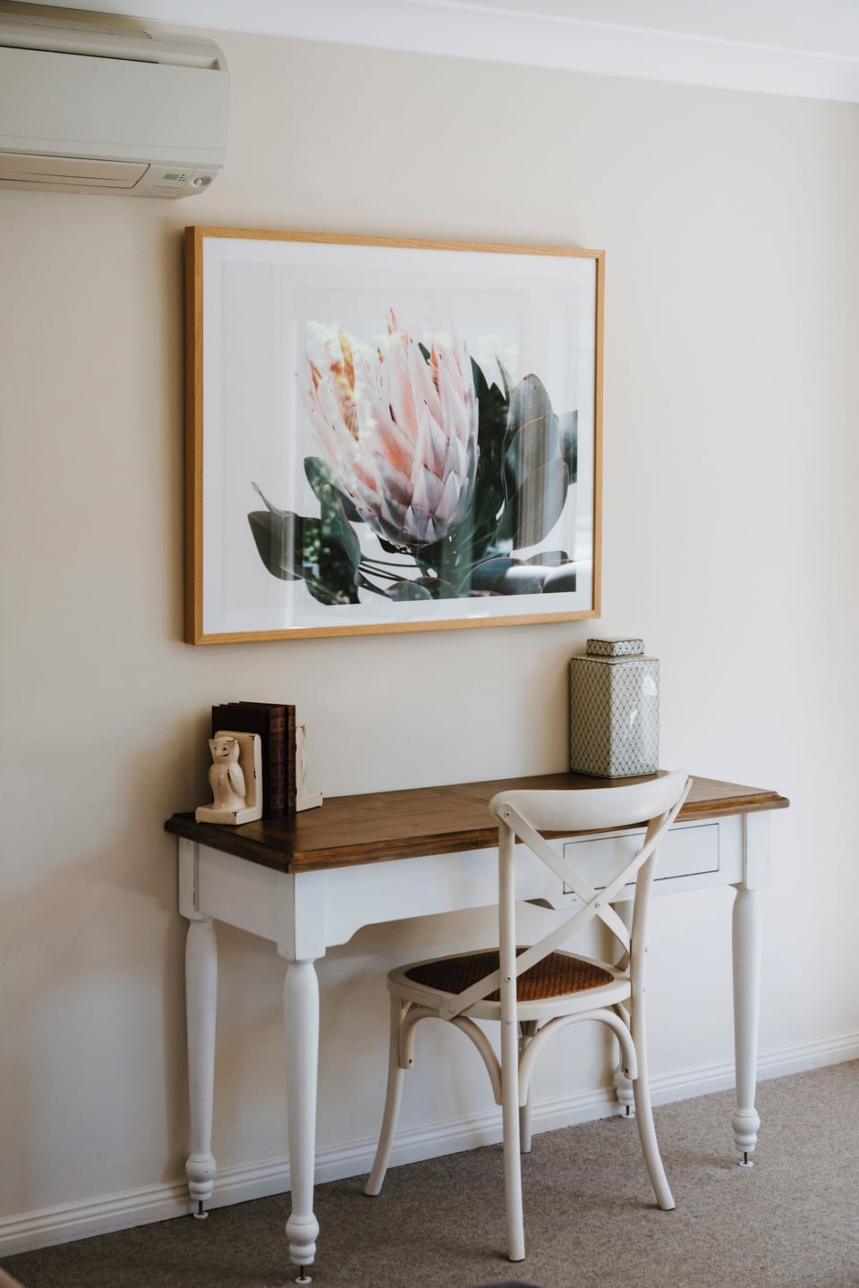 Find a quiet moment at the dedicated workspace, where a classic timber desk offers the perfect spot to write, read, or catch up on work.