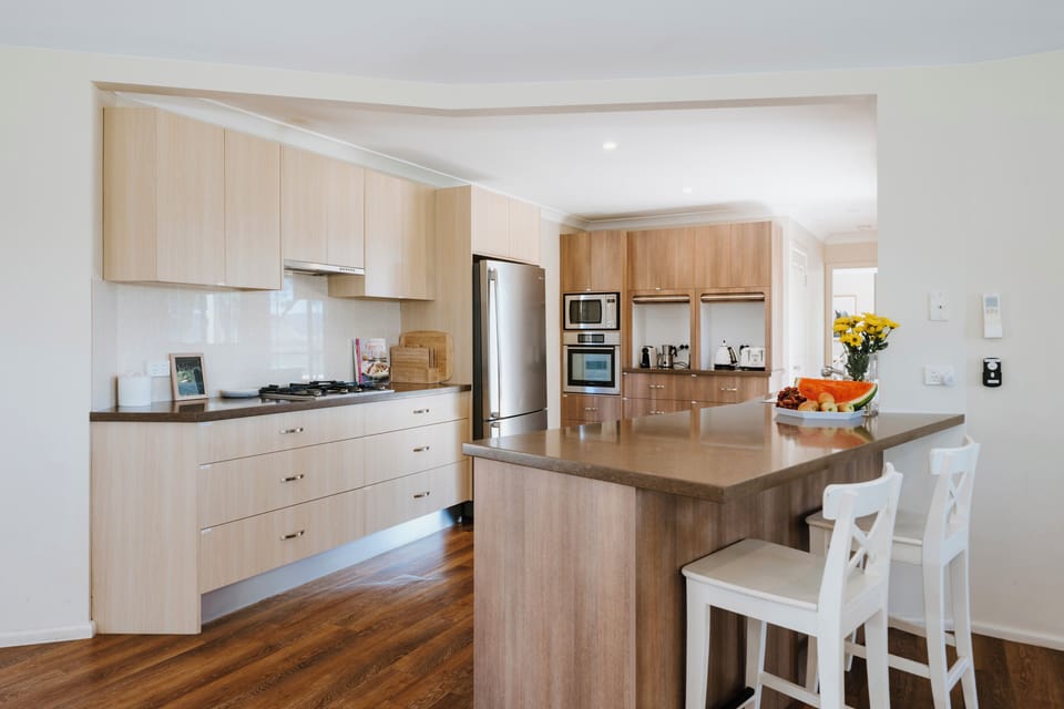 Start the day at the breakfast bar with stools, sharing fresh coffee and quick bites before heading out to explore the valley.