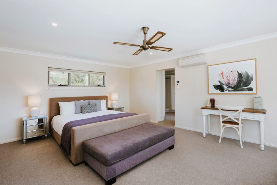 Retreat to the primary suite, where a king bed and the rare comfort of dual ensuites offer a touch of indulgence and timeless style.