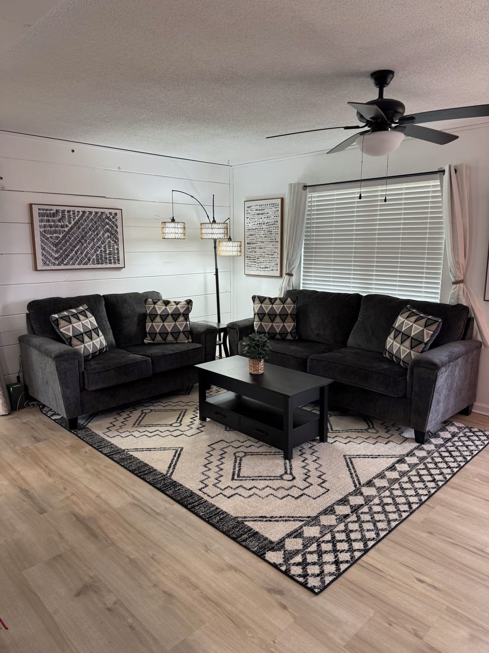 Large comfortable living room with flat screen TV.