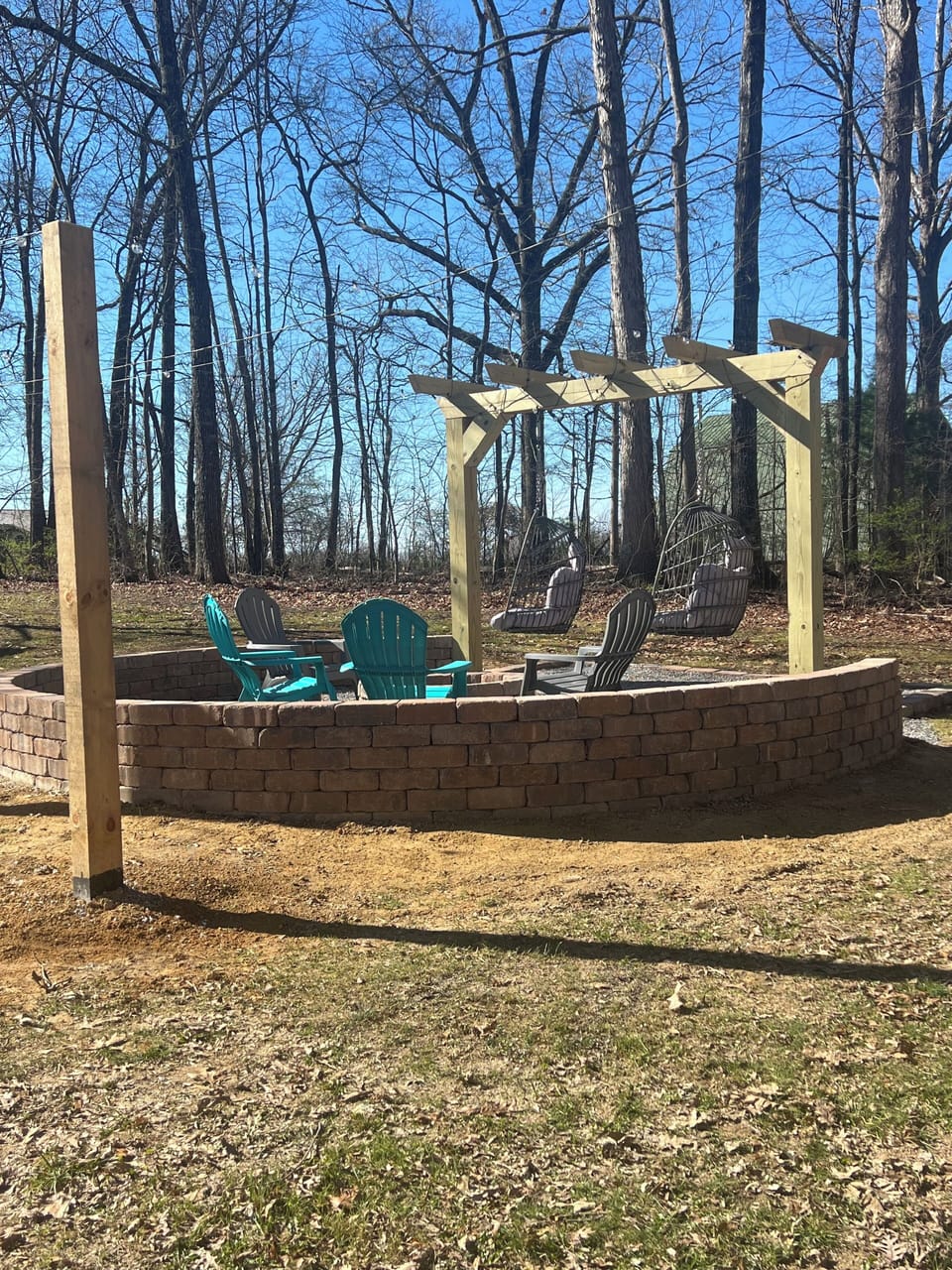Beautiful outdoor firepit with lights for enjoying after dark.