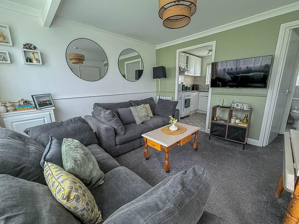This cosy living room is perfect for getting the fmaily together to discuss the plans for the day