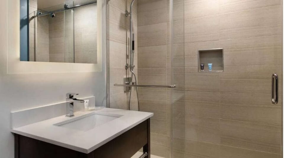 Start your day with a sleek vanity and roomy shower.