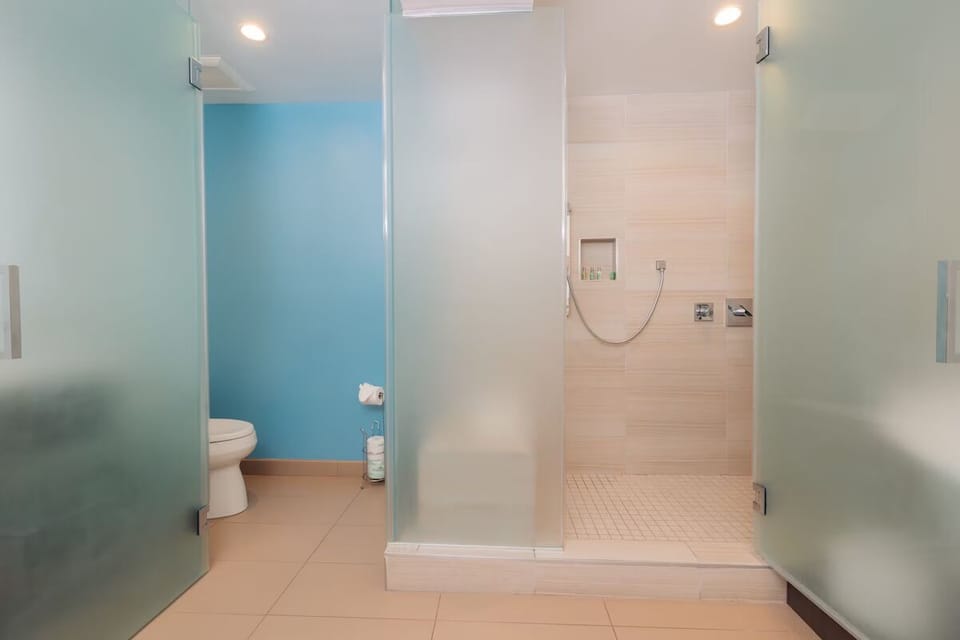 Refresh easily with a spacious walk-in shower and privacy.