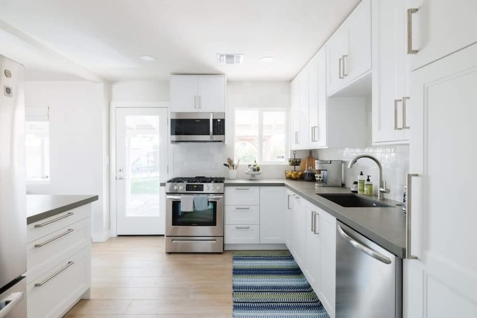 Bright kitchen - fully stocked with all necessities.