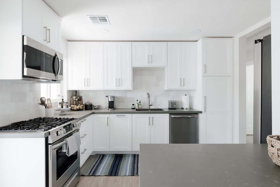 Bright kitchen - fully stocked with all necessities.