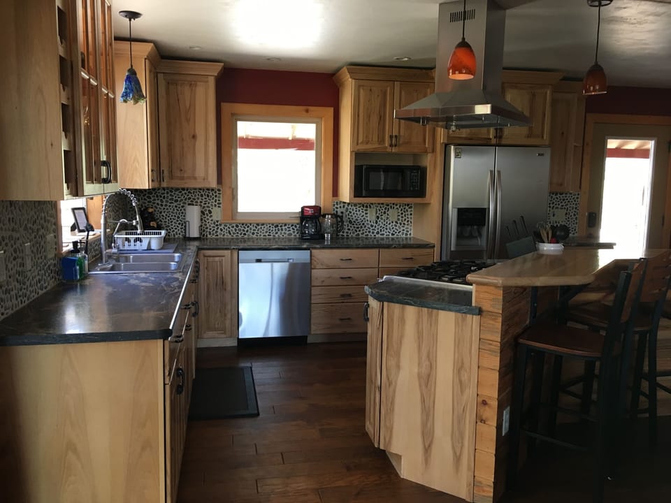 Fully equipped kitchen for all your cooking/baking needs. Bar that seats four.