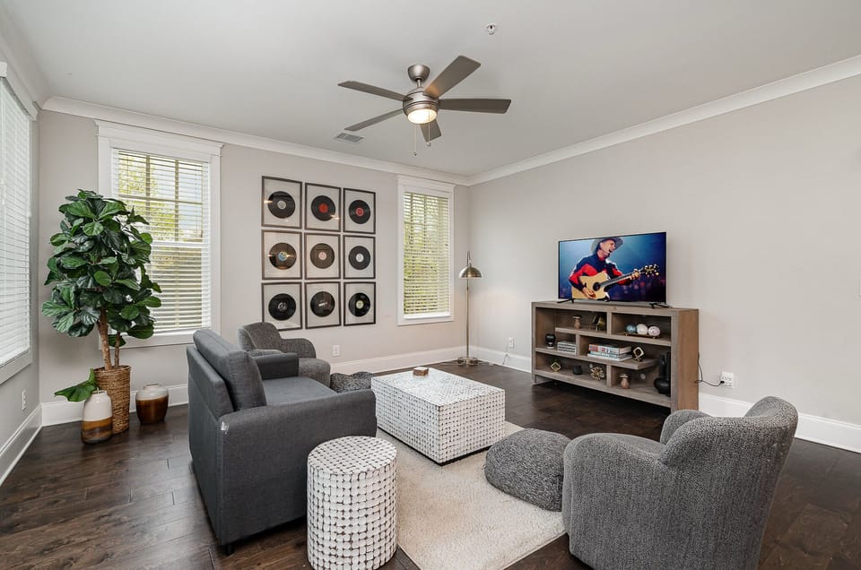 Unit 2: Open and inviting living space featuring a Smart TV and cozy furnishings.