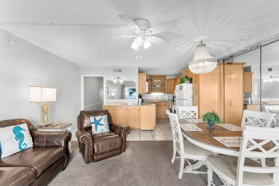 Spacious living room with Queen size fold out sofa, dining area and fully stocked kitchen