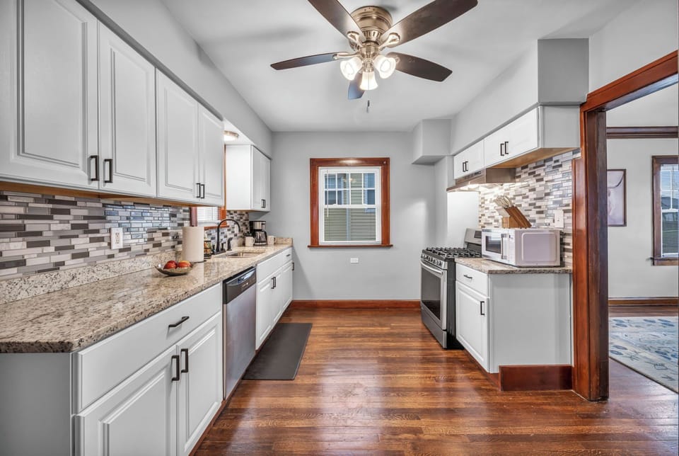 Fully equipped kitchen with air fryer, crockpot, toaster, and baking pans