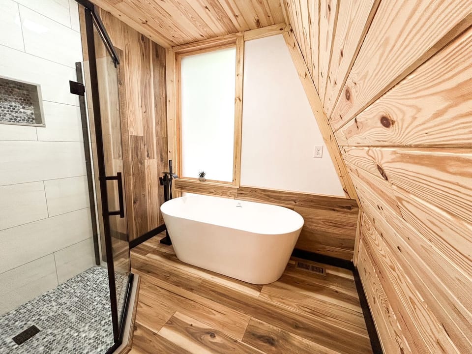 Soaking tub with privacy glass.