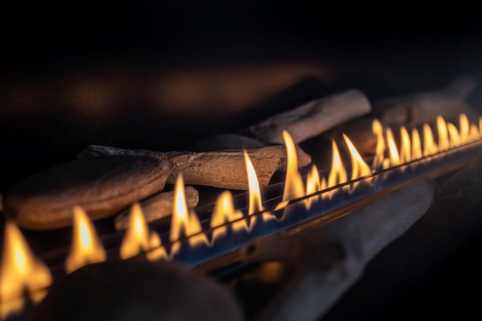 Contemporary linear fireplace for instant ambiance—romantic nights or cozy mornings by the flames.