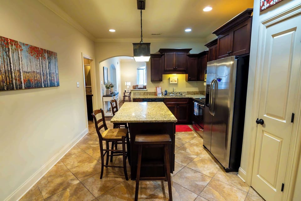 With high-end appliances and abundant cabinetry, this fully stocked kitchen is ready for all your cooking and dining adventures.