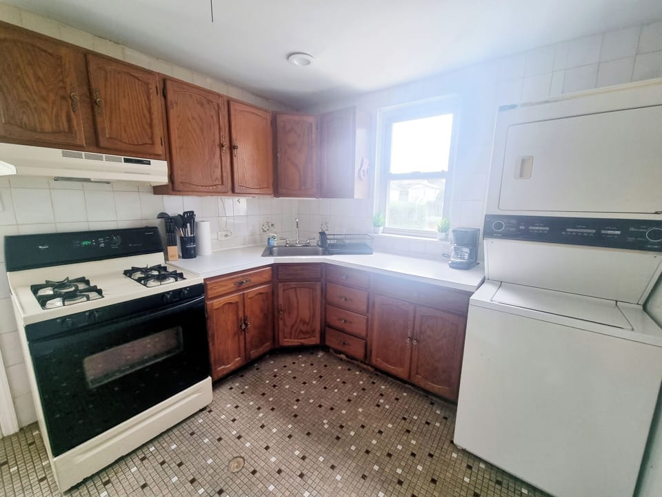 Step into a well-appointed kitchen designed for convenience. It includes a full-sized refrigerator, range, and plenty of counter space for meal prep. You'll find generous storage in the cabinetry, making it easy to keep things organized.
