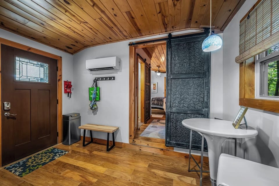 Bedroom 2 sits quietly near the home’s entrance, just off the kitchen—a cozy, tucked-away retreat on the opposite side of the cottage.