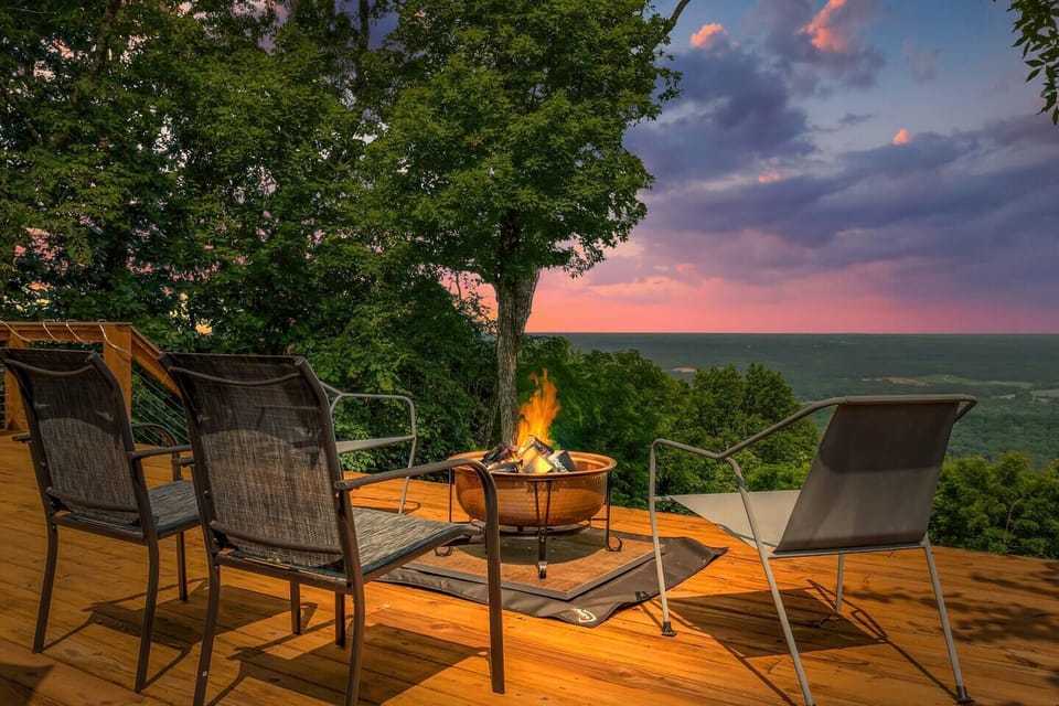 Perched high above the valley, the expansive deck offers an unmatched vantage point—perfect for soaking in golden sunrises, dramatic sunsets, and star-filled nights. Whether you`re sipping coffee or enjoying an evening by the firepit, this scenic ove