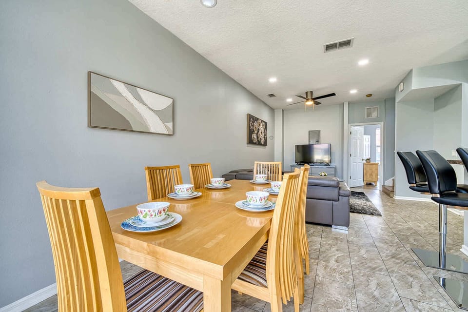 Open dining and living area with modern seating and natural light
