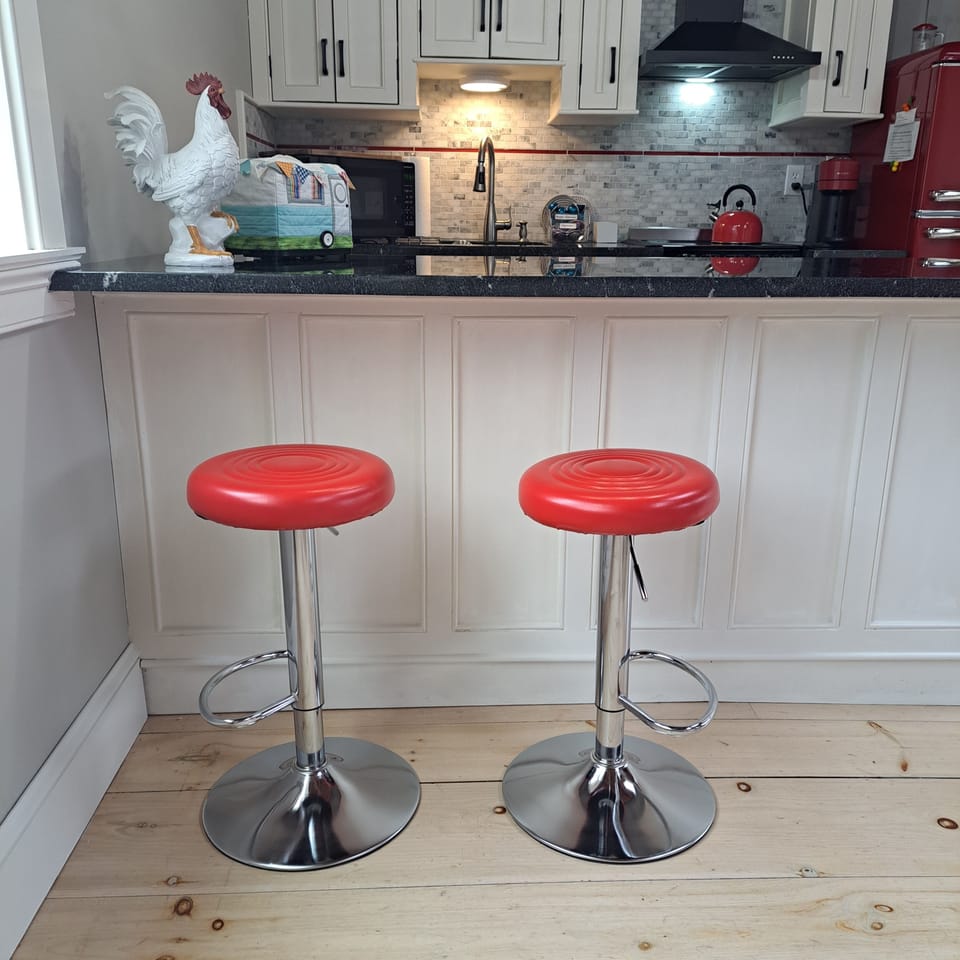 Bar stools at kitchen counter.