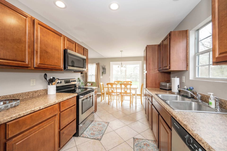 The inviting kitchen offers ample space & every home comfort