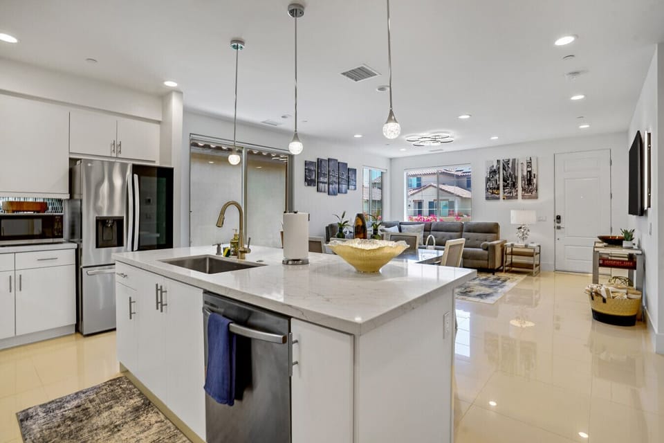 A view of the center island table by the kitchen to the living area