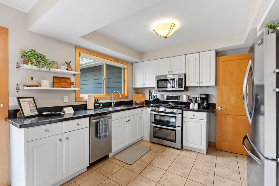 Your fully equipped kitchen features sleek appliances, granite counters, and everything you need to create memorable meals during your stay.