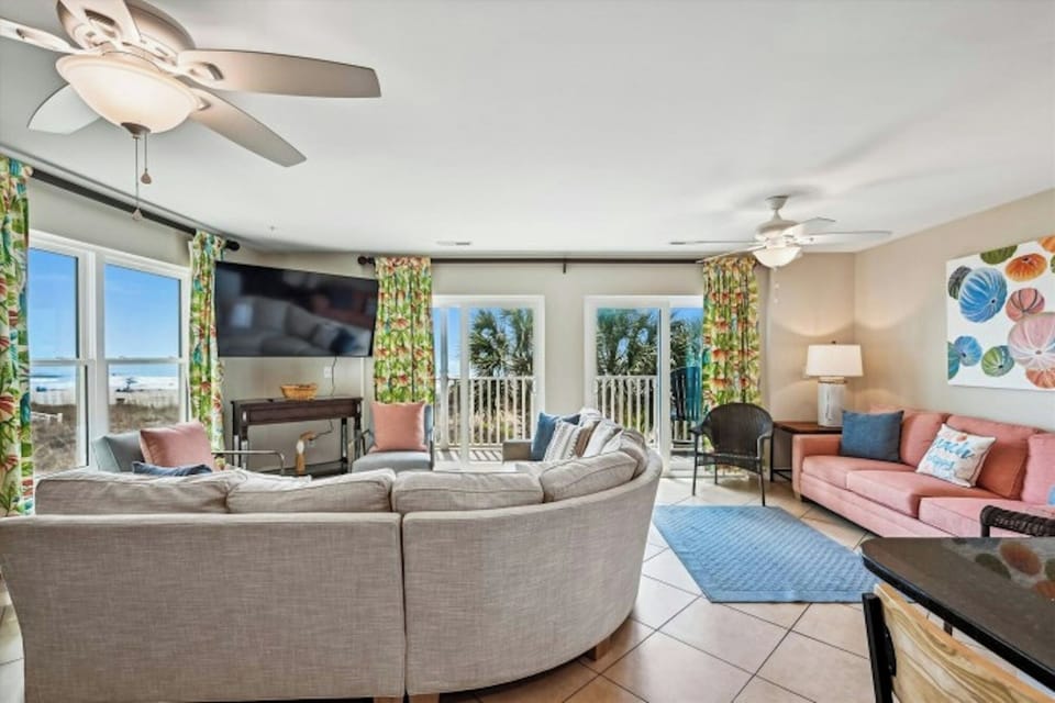 The ocean front living room is well-appointed with comfortable furnishings.