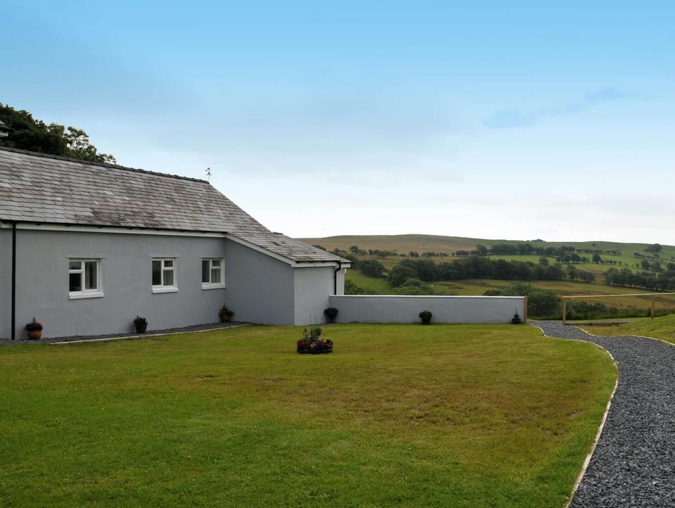 The outside of Llaethdy Rachel and lawn to the front