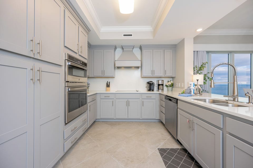 Upgrade your culinary experience in this stylish kitchen with modern stainless appliances and elegant design