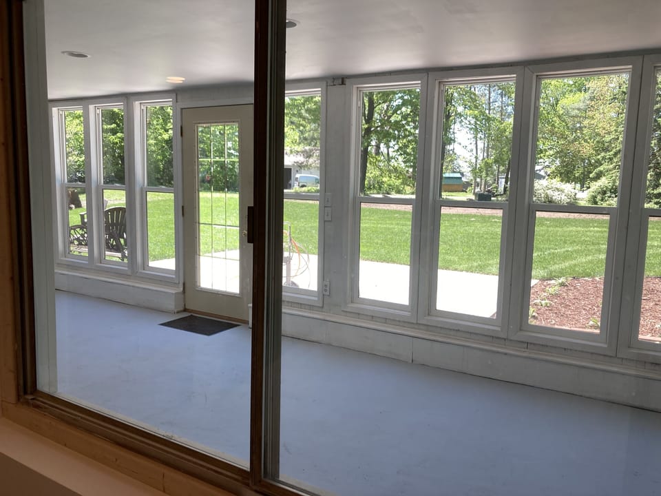 Lower level, walk-out three season room & patio area