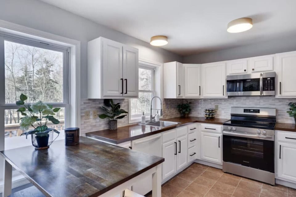 Fully equipped kitchen with a spacious island—perfect for cooking, entertaining, and extra seating for casual meals or morning coffee.