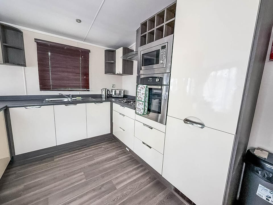 Bright and modern kitchen is perfect for cooking those family favourites whilst your away.