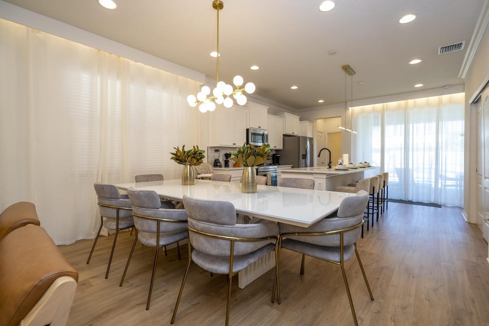 Spacious modern kitchen with sleek island and elegant lighting