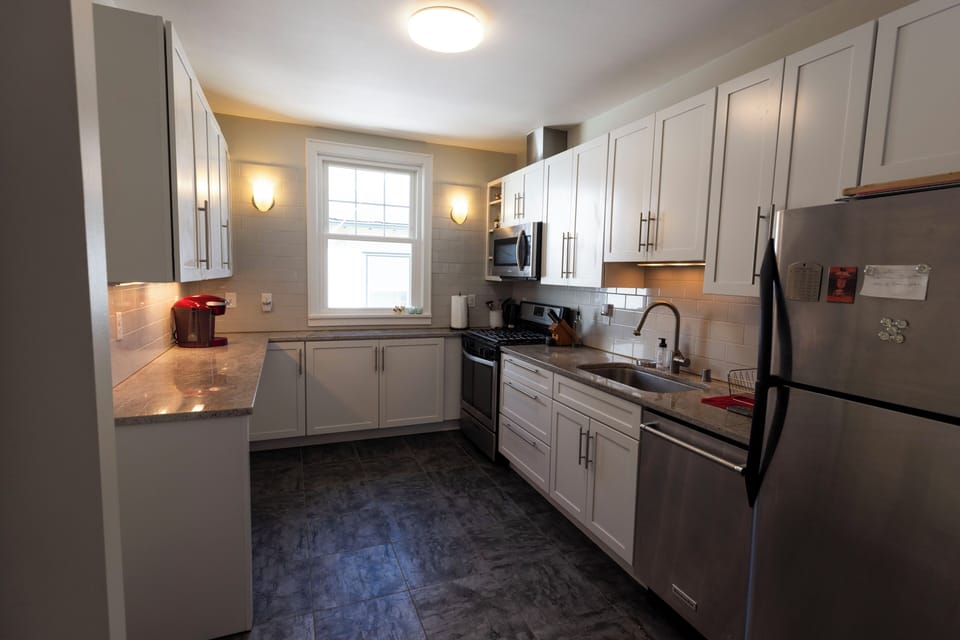 Modern kitchen with washer and dryer