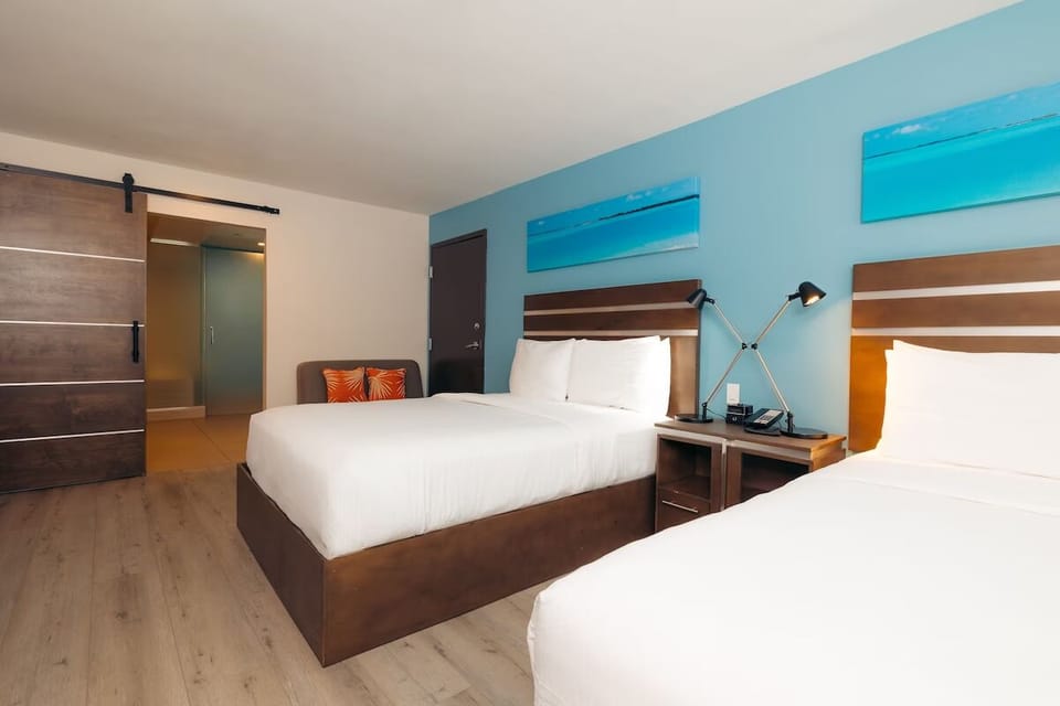 Recharge in a serene room with warm lighting and style.