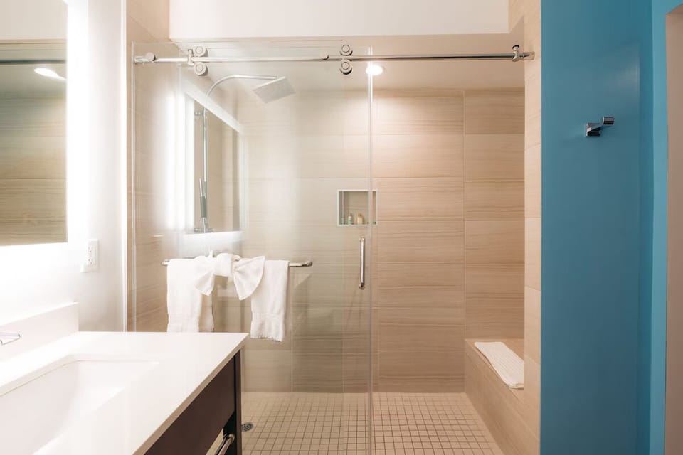 Refresh in a bright glass shower with spa-like finishes.