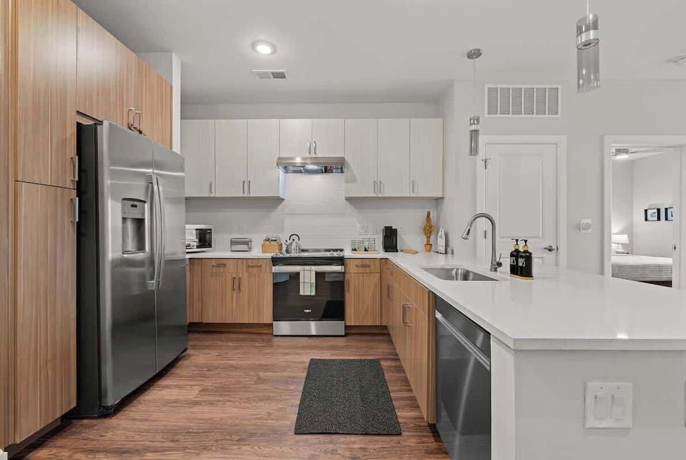 Kitchen: Modern elegance meets functionality with sleek appliances and stylish finishes!

