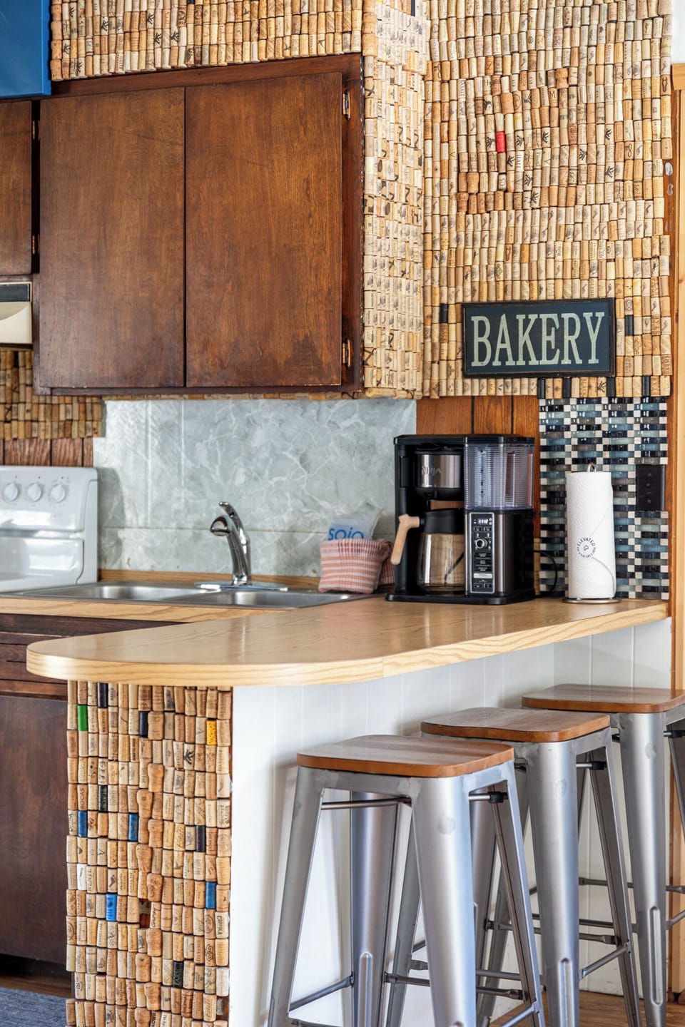 Coffee station w/ counter space, wood cabinetry & charming rustic details.