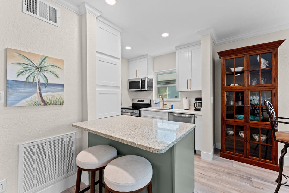 Enjoy a bright and inviting space for dining, relaxing, or planning your next beach day with family and friends.