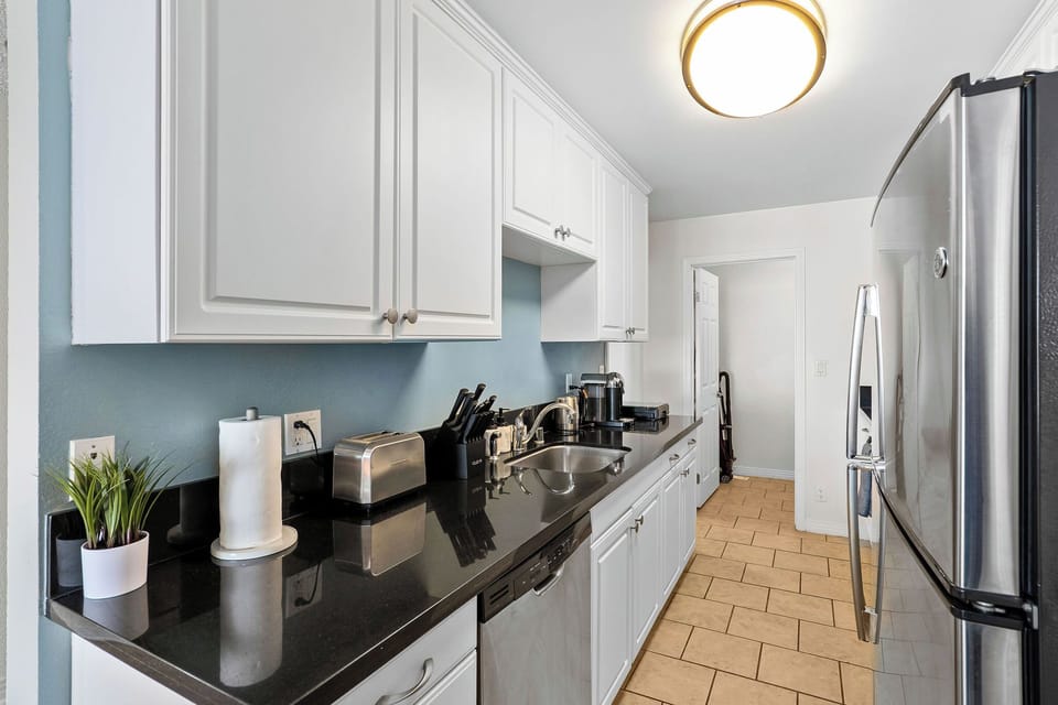 Full-sized stainless steel appliances for gourmet meals.