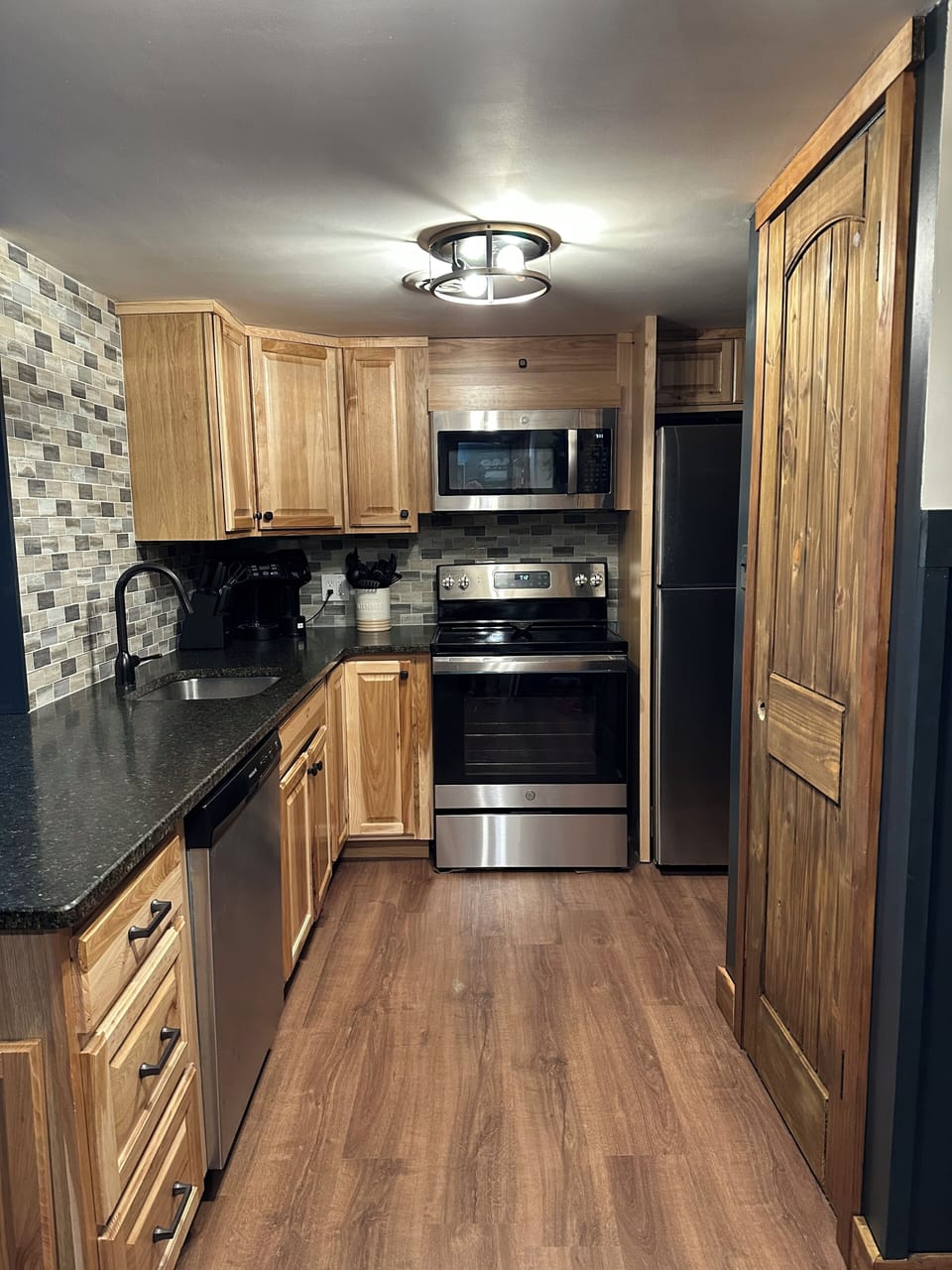 Full size appliances in newly remodeled kitchen