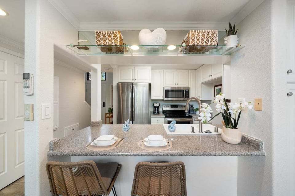 Fully equipped kitchen with island seating, perfect for casual dining and prep.