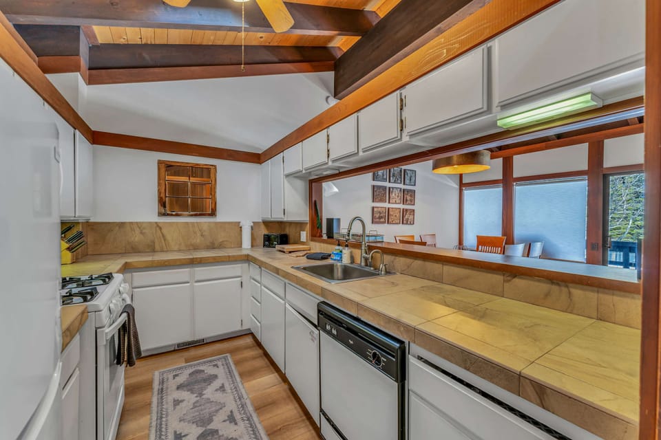 Kitchen: Second floor, drip coffee maker, blender, toaster, cooking utensils, tableware