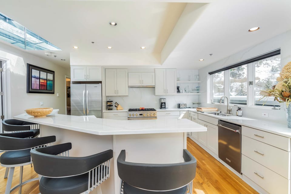 Kitchen: Main floor, drip coffee maker, toaster, blender, cooking utensils, tableware
