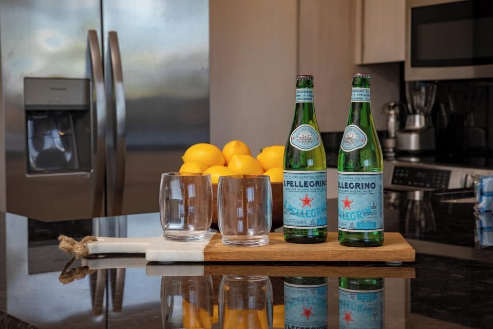 Begin your stay with a sparkle, cool drinks, sunny lemons, and a kitchen designed for comfort, calm, and connection   