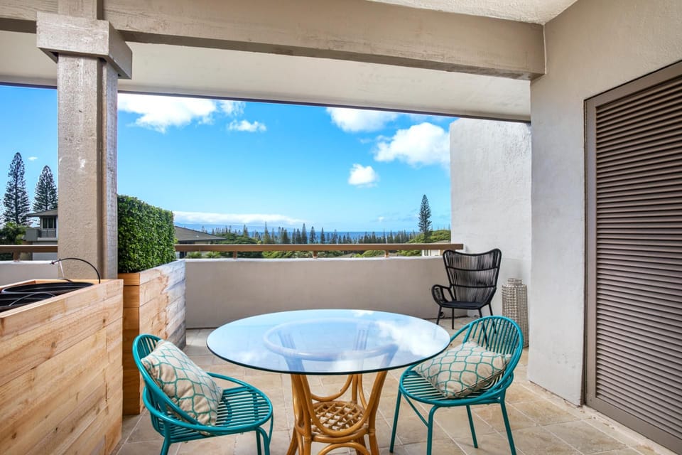 Just steps from your bed, this private lanai invites you to sip coffee to mountain views and fall asleep to island breezes   