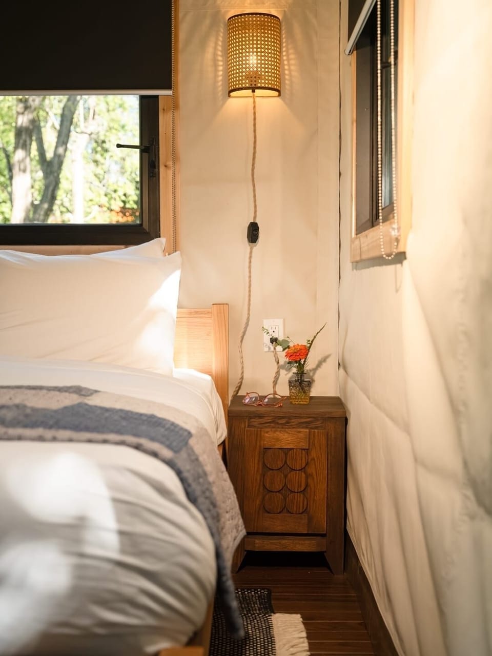 Sink into crisp linens under a warm, golden glow.