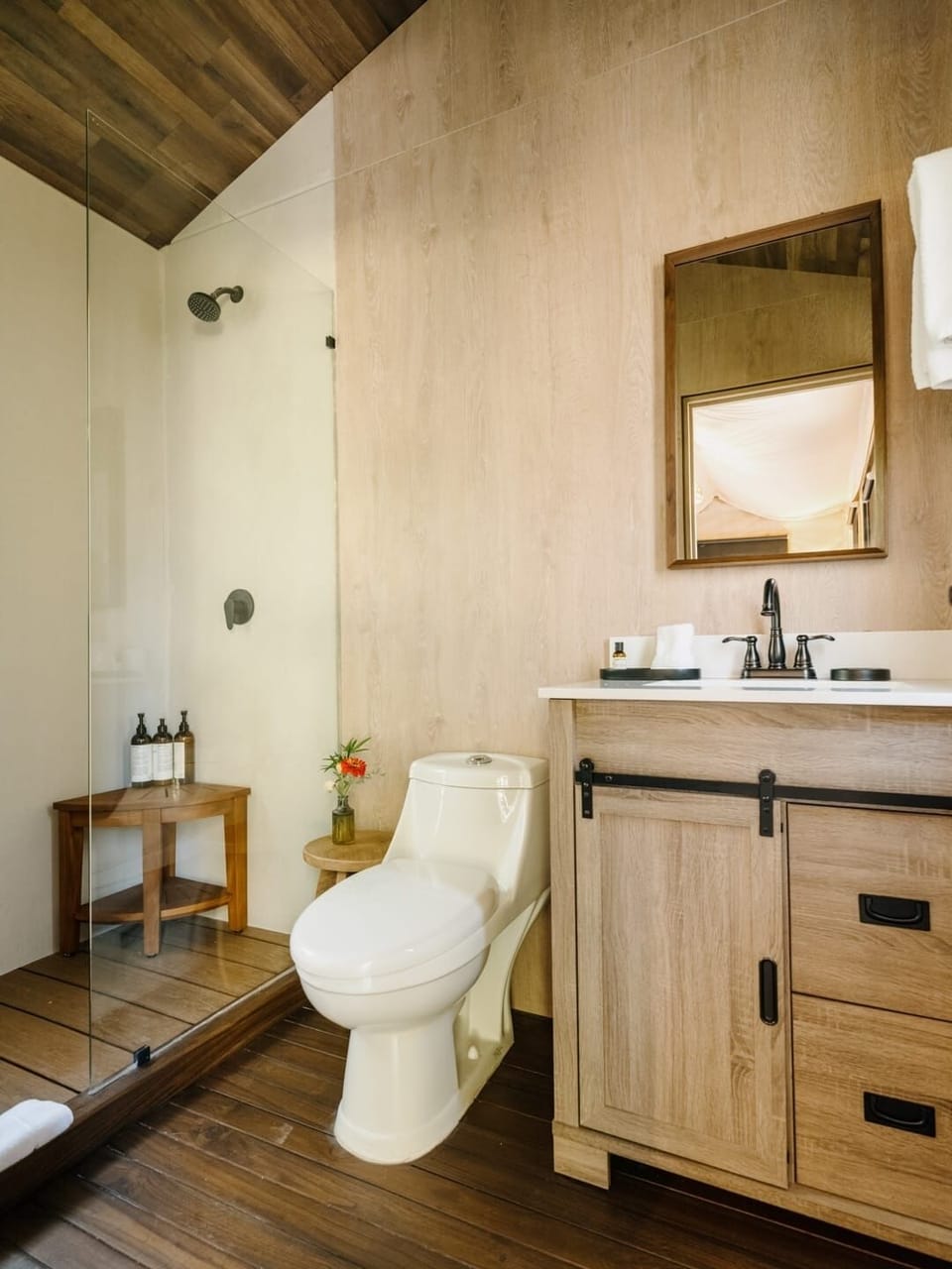 Refresh in a spa-style bath with glass shower serenity.