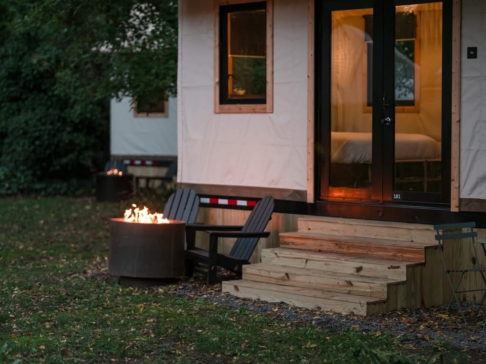 Sip wine outside as the firepit flickers beside you.